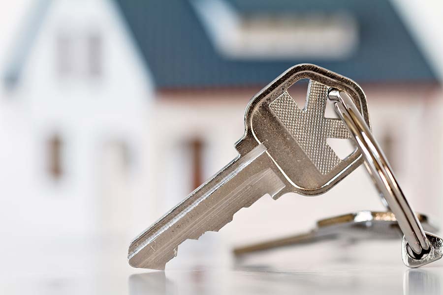 Keys in front of a new home that just passed through our home inspection services